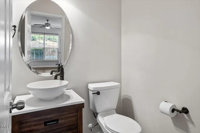 a view of a room with wooden floor and chandelier