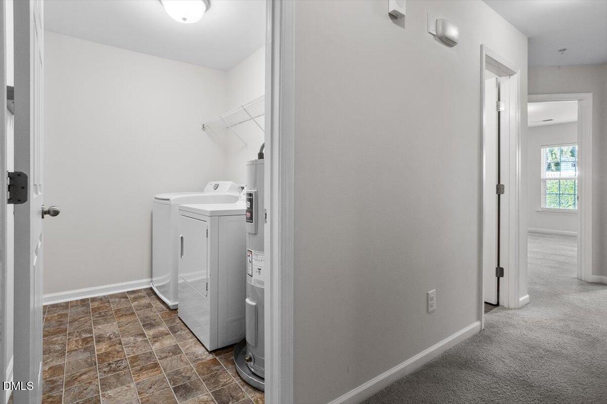 1120 Renewal Place, Unit 113 Raleigh, NC 27603 - Photo 16 of 38 a bathroom with a sink and a shower