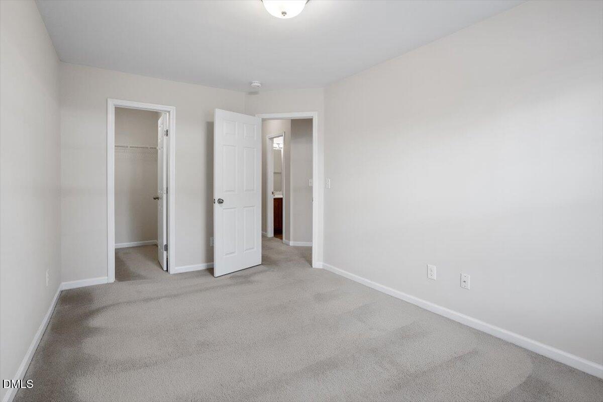 1120 Renewal Place, Unit 113 Raleigh, NC 27603 - Photo 21 of 38 an empty room with closet area