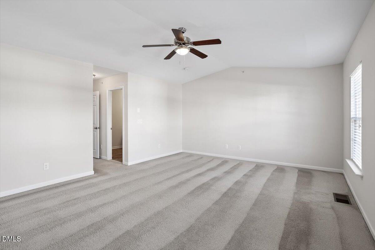 1120 Renewal Place, Unit 113 Raleigh, NC 27603 - Photo 27 of 38 wooden floor in an empty room with a window