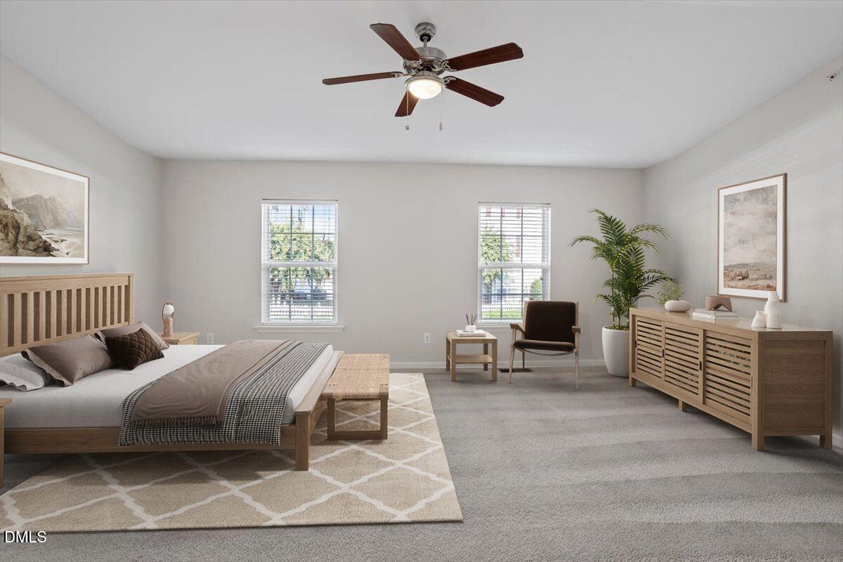 1120 Renewal Place, Unit 113 Raleigh, NC 27603 - Photo 6 of 38 a bedroom with a large bed couch and a window