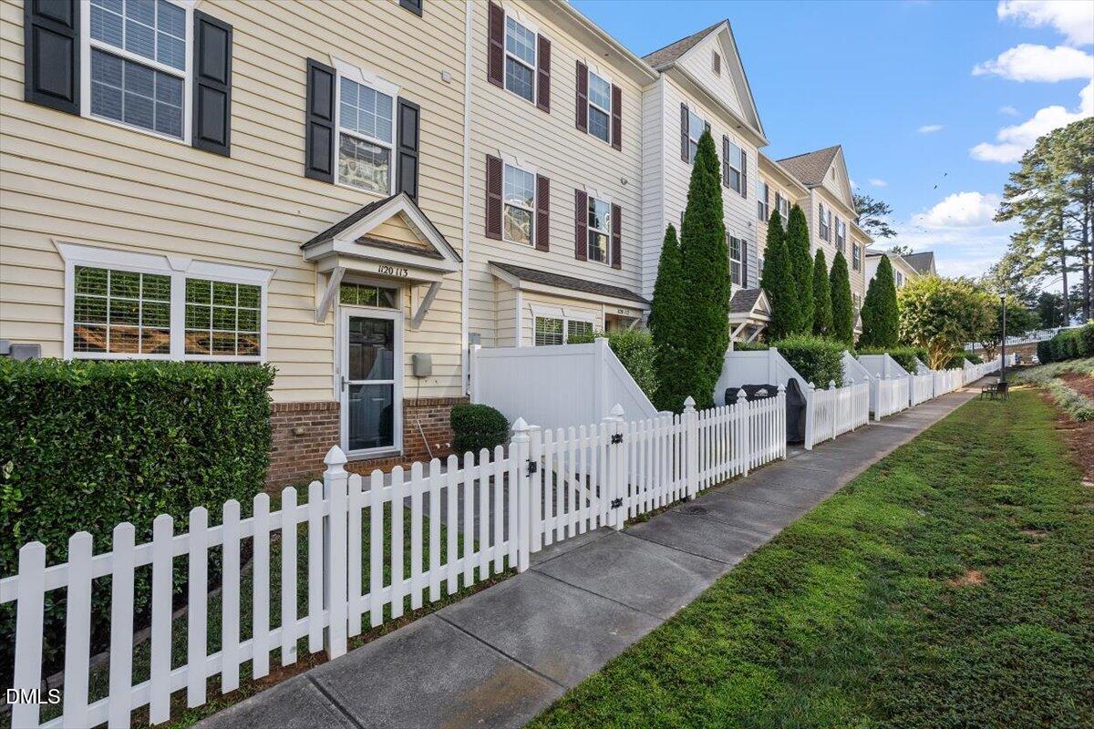 1120 Renewal Place, Unit 113 Raleigh, NC 27603 - Photo 8 of 38 a view of a house with backyard and porch