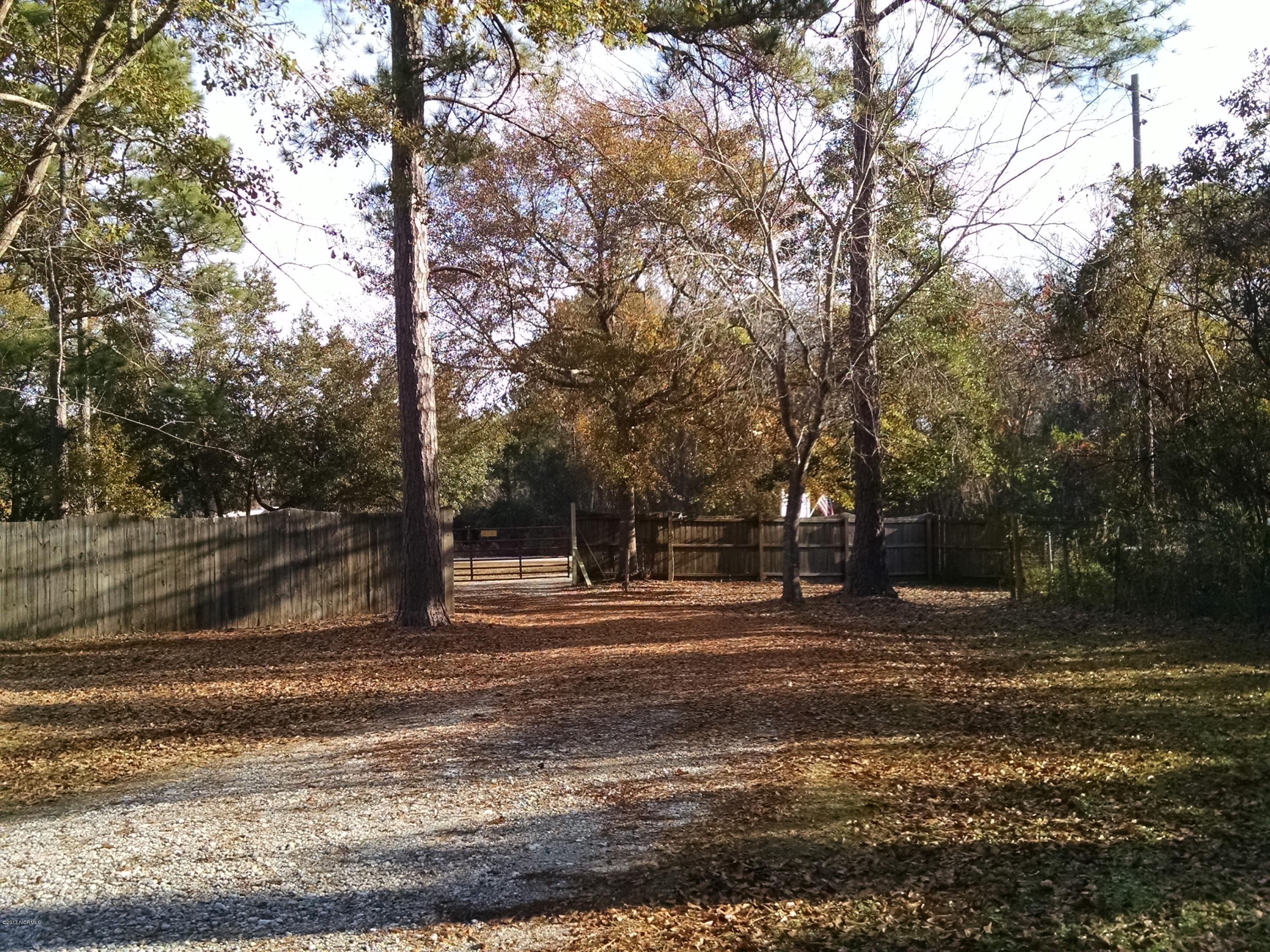 3701 East Boiling Spring Road Southport, NC 28461 - Photo 16 of 54 Front driveway gate to road