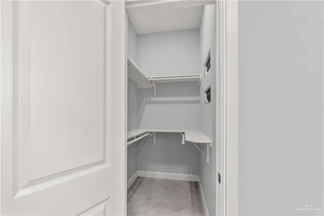 a view of an empty walk in closet