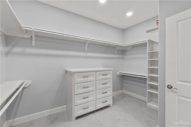 a view of an empty walk in closet