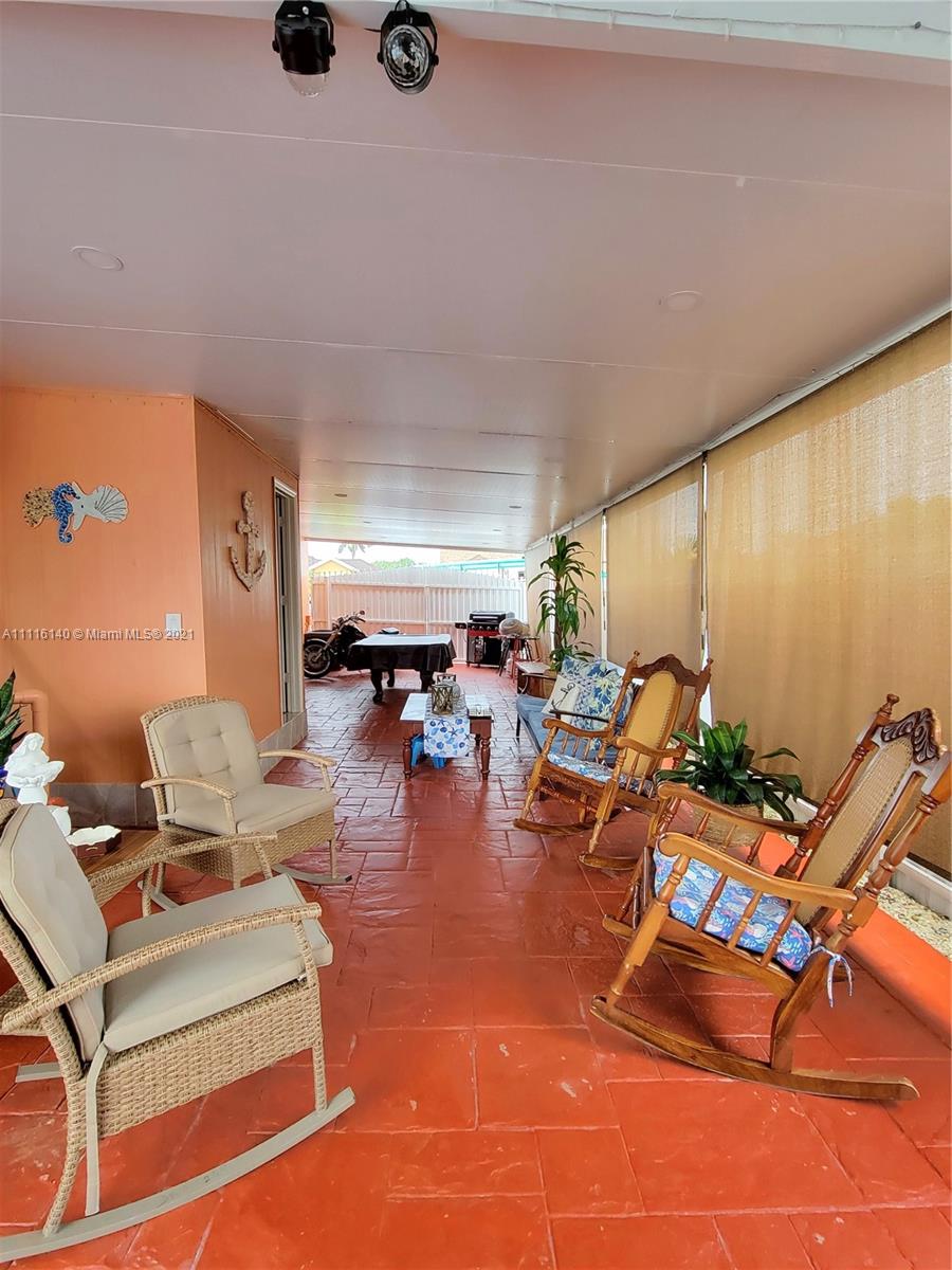 12989 Southwest 251st Terrace Homestead, FL 33032 - Photo 15 of 28 an outdoor space with patio furniture
