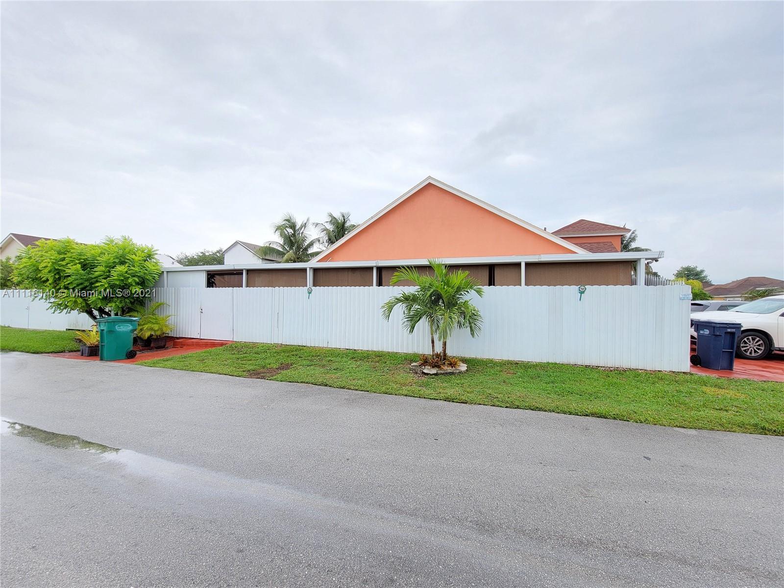 12989 Southwest 251st Terrace Homestead, FL 33032 - Photo 28 of 28 a front view of a house with a yard and garage