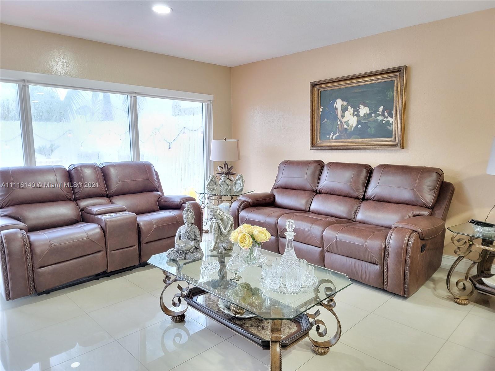 12989 Southwest 251st Terrace Homestead, FL 33032 - Photo 5 of 28 a living room with furniture and a large window