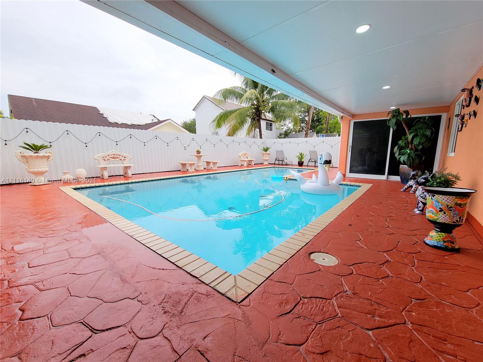 12989 Southwest 251st Terrace Homestead, FL 33032 - Photo 9 of 28 a room with pool table and sofas