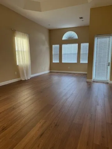 a view of hallway with wooden floor