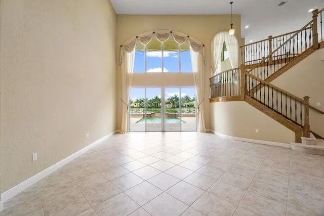 a utility room with cabinets washer and dryer