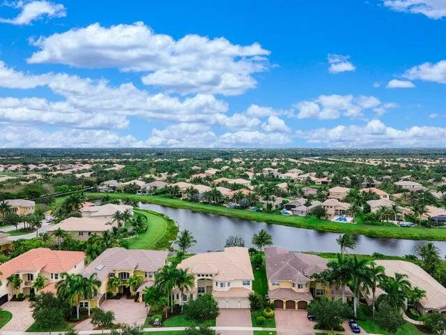 a swimming pool with outdoor seating and yard