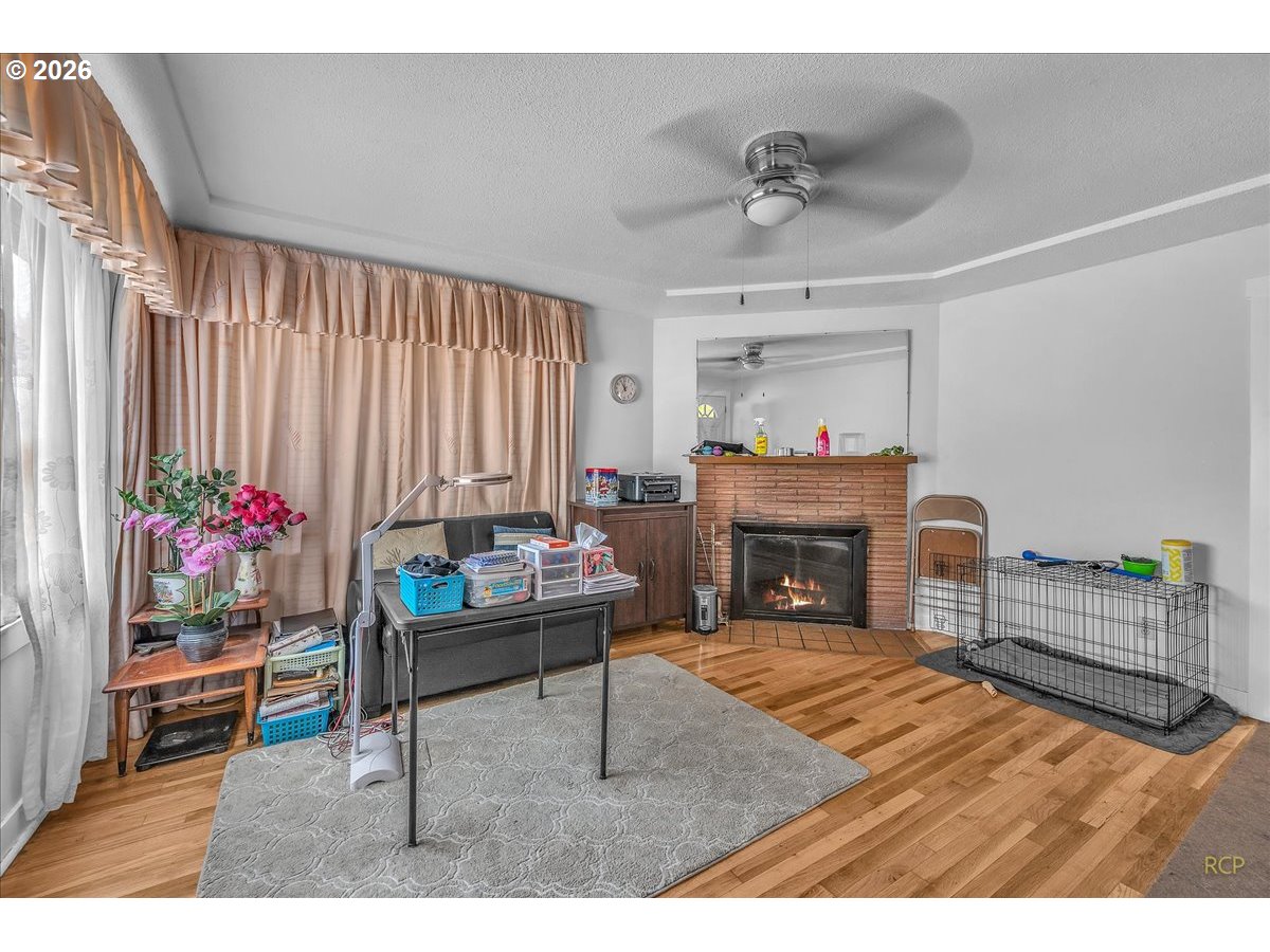 240 Northeast 80th Avenue Portland, OR 97213 - Photo 2 of 25 a living room with furniture and a fireplace