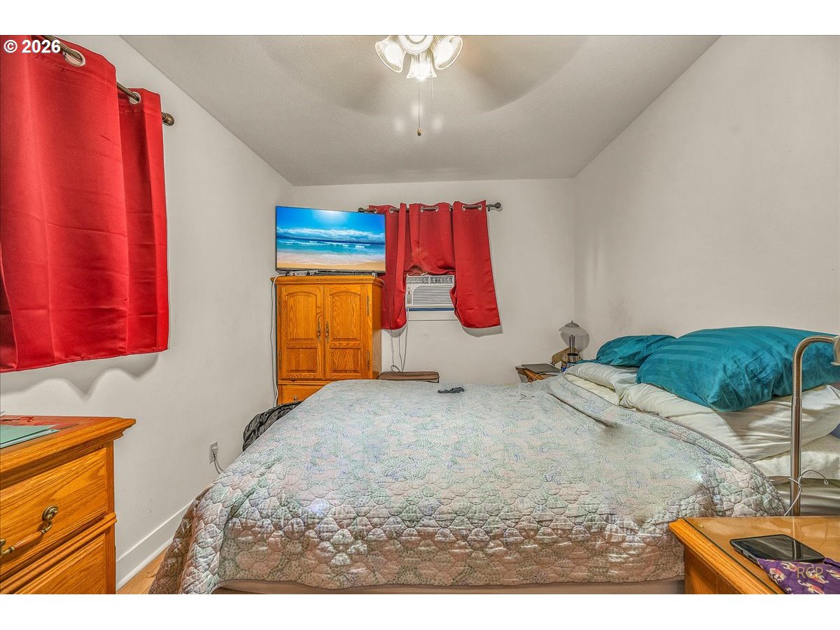 240 Northeast 80th Avenue Portland, OR 97213 - Photo 4 of 25 a bed room with a bed and a couch