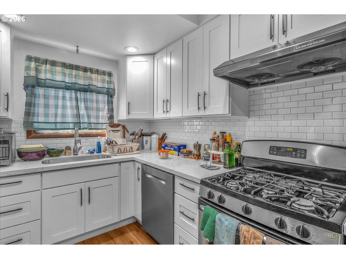 240 Northeast 80th Avenue Portland, OR 97213 - Photo 6 of 25 a kitchen with sink and cabinets