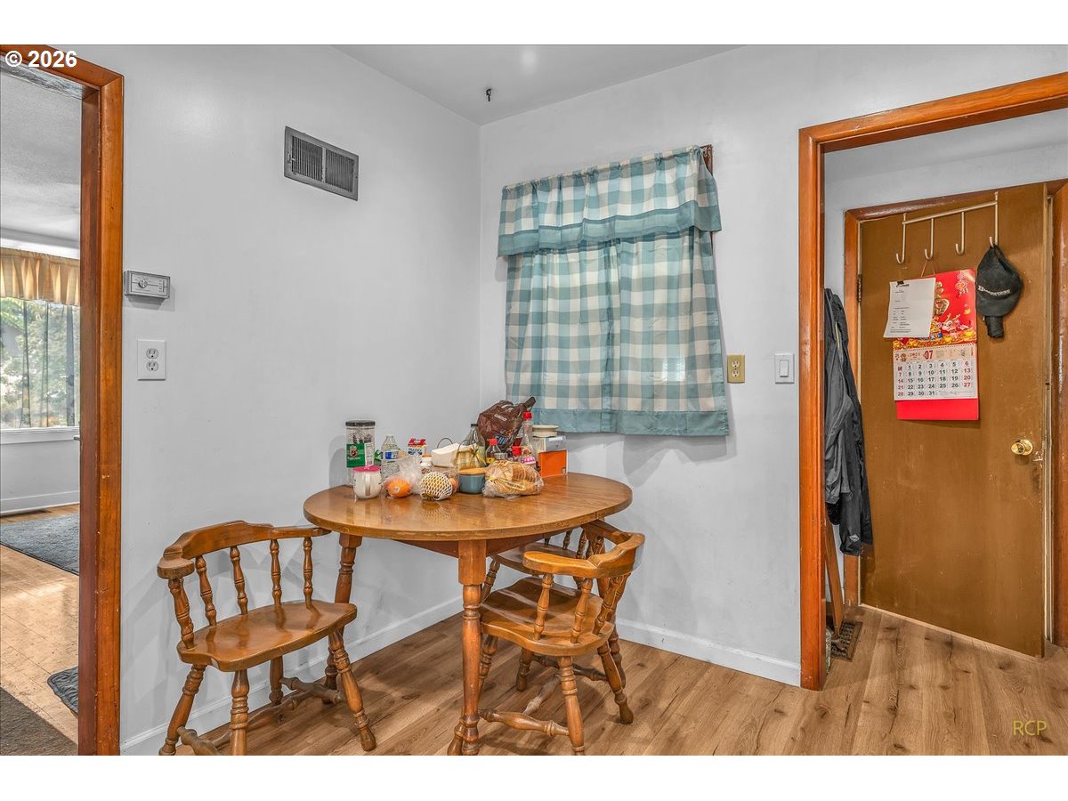 240 Northeast 80th Avenue Portland, OR 97213 - Photo 8 of 25 a view of a dining room with furniture and window