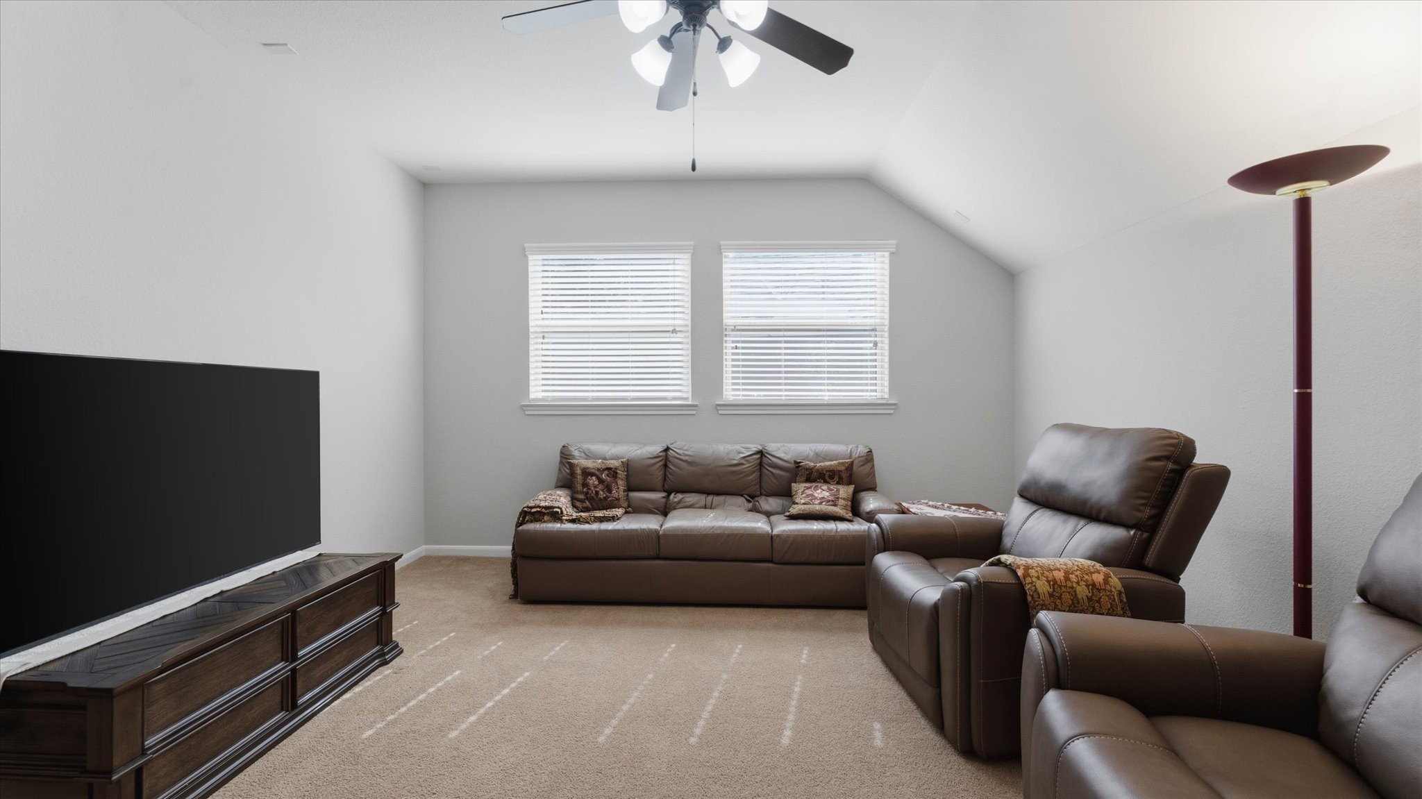 14 Painted Post Place Spring, TX 77389 - Photo 26 of 43 a living room with furniture and a flat screen tv