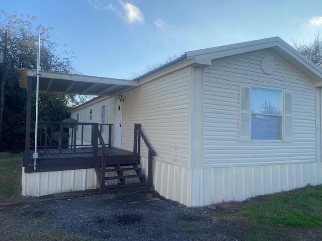 1620 East Reno Road, Unit 21 Azle, TX 76020 - Photo 1 of 10 a view of backyard with deck and outdoor seating