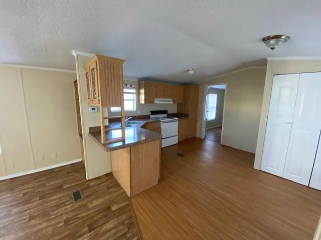 1620 East Reno Road, Unit 21 Azle, TX 76020 - Photo 3 of 10 a kitchen with stainless steel appliances granite countertop a refrigerator a stove top oven a sink and dishwasher