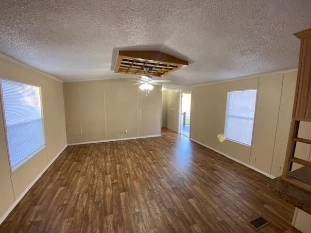 1620 East Reno Road, Unit 21 Azle, TX 76020 - Photo 4 of 10 a view of an empty room with wooden floor and a window