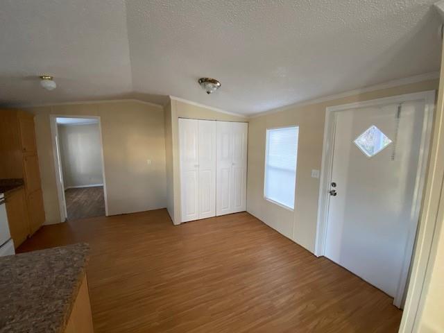1620 East Reno Road, Unit 21 Azle, TX 76020 - Photo 5 of 10 a view of an empty room with wooden floor and a bathroom