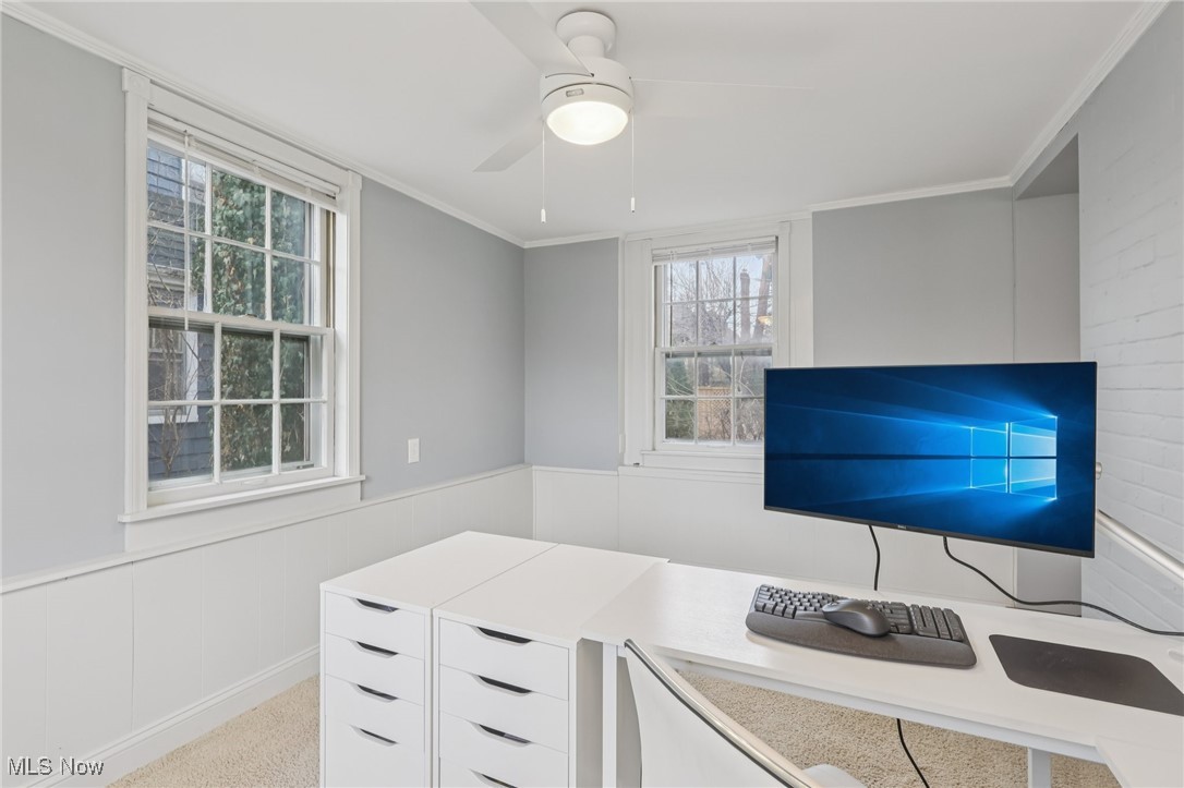 17024 Fernway Road Cleveland, OH 44120 - Photo 20 of 46 Office space featuring wainscoting, ornamental molding, a ceiling fan, and light carpet