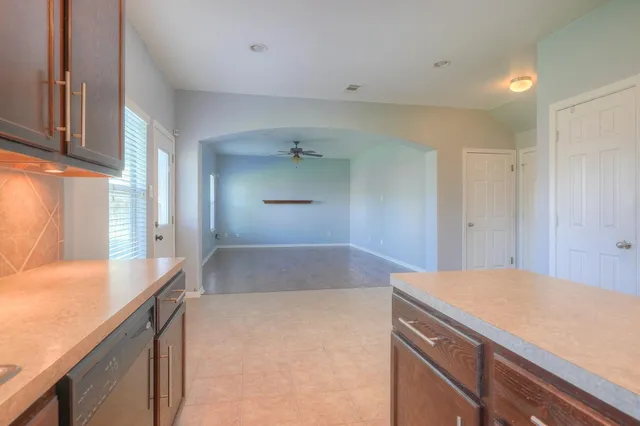 a bedroom with a sink and vanity