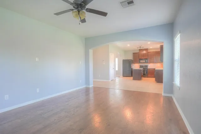 a view of an empty room with a window