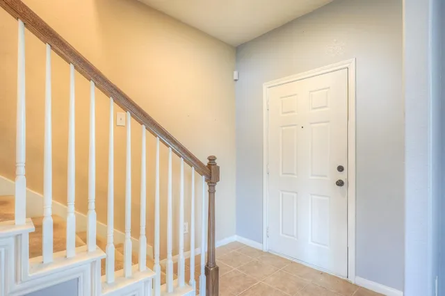 a view of staircase with rug