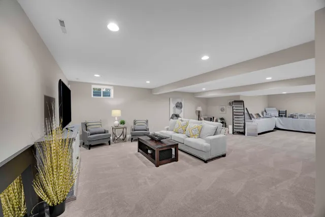 a view of a hallway with wooden floor and entryway