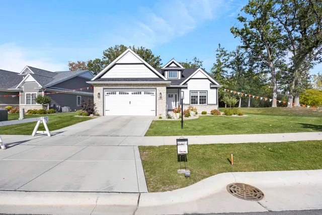 an aerial view of residential house with outdoor space and swimming pool