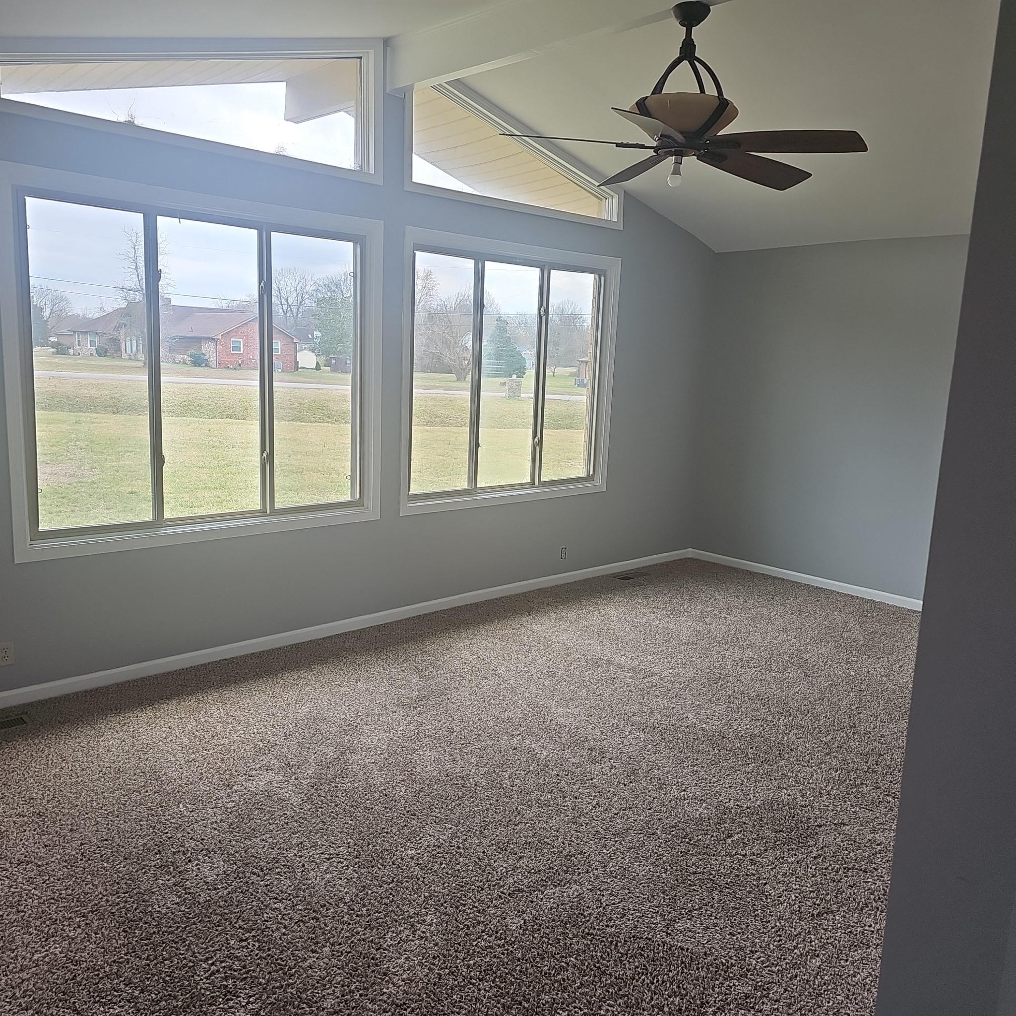 a view of an empty room with a window