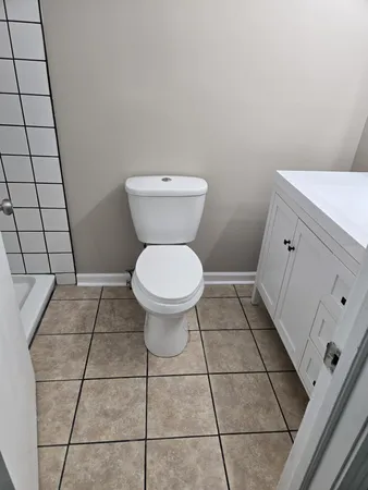 a bathroom with a toilet and a sink