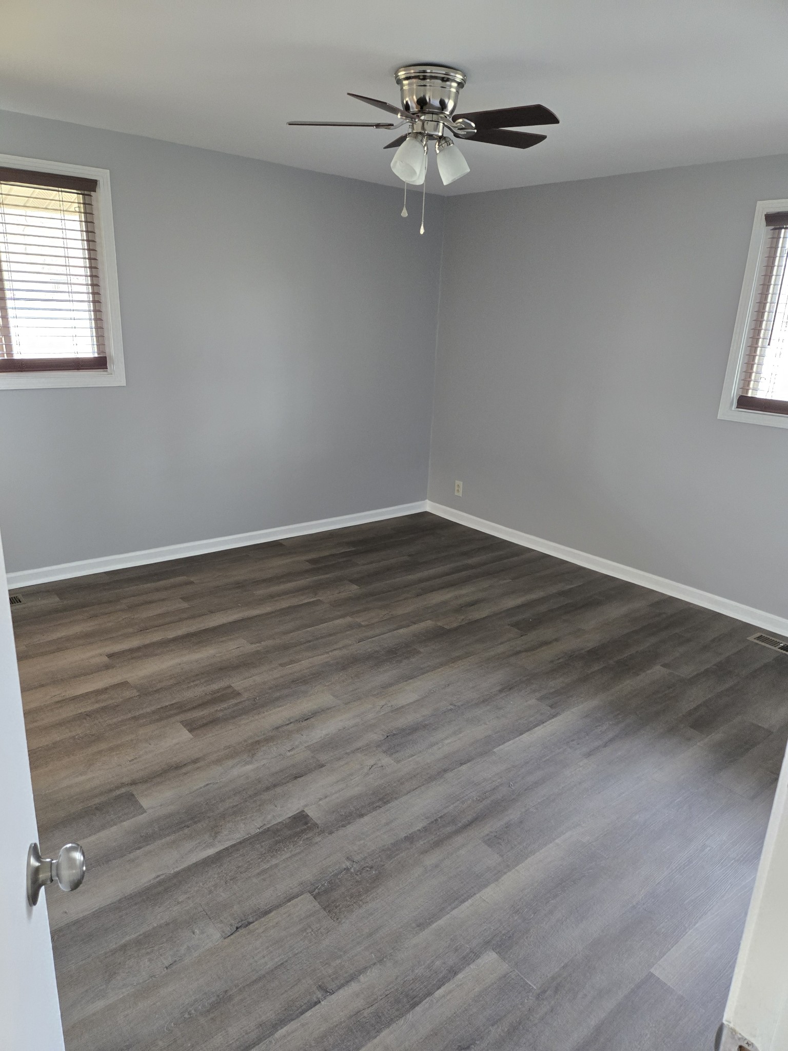 4100 Cato Road Nashville, TN 37218 - Photo 12 of 17 an empty room with wooden floor fan and windows