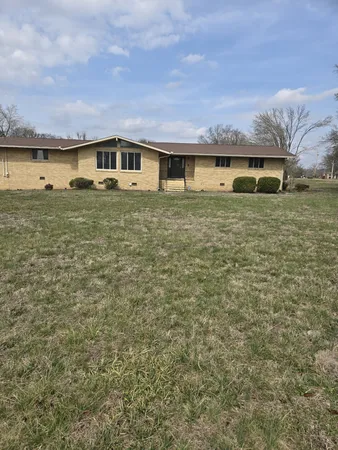 a front view of house with a yard
