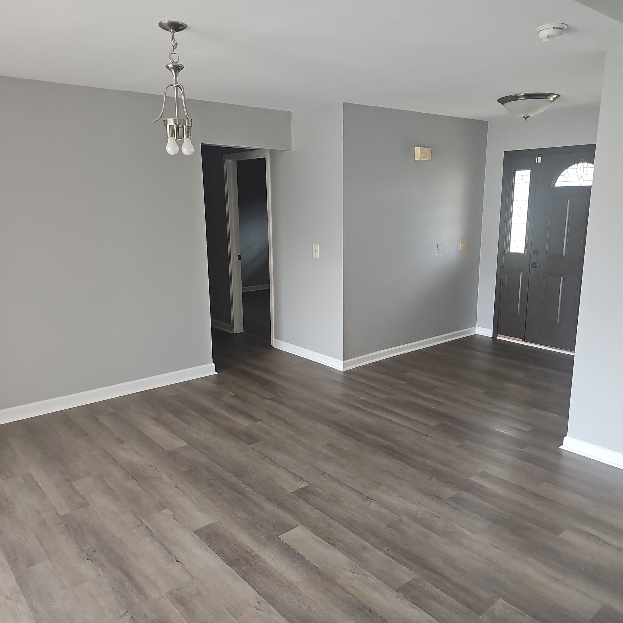 4100 Cato Road Nashville, TN 37218 - Photo 2 of 17 a view of an empty room with wooden floor and a bathroom
