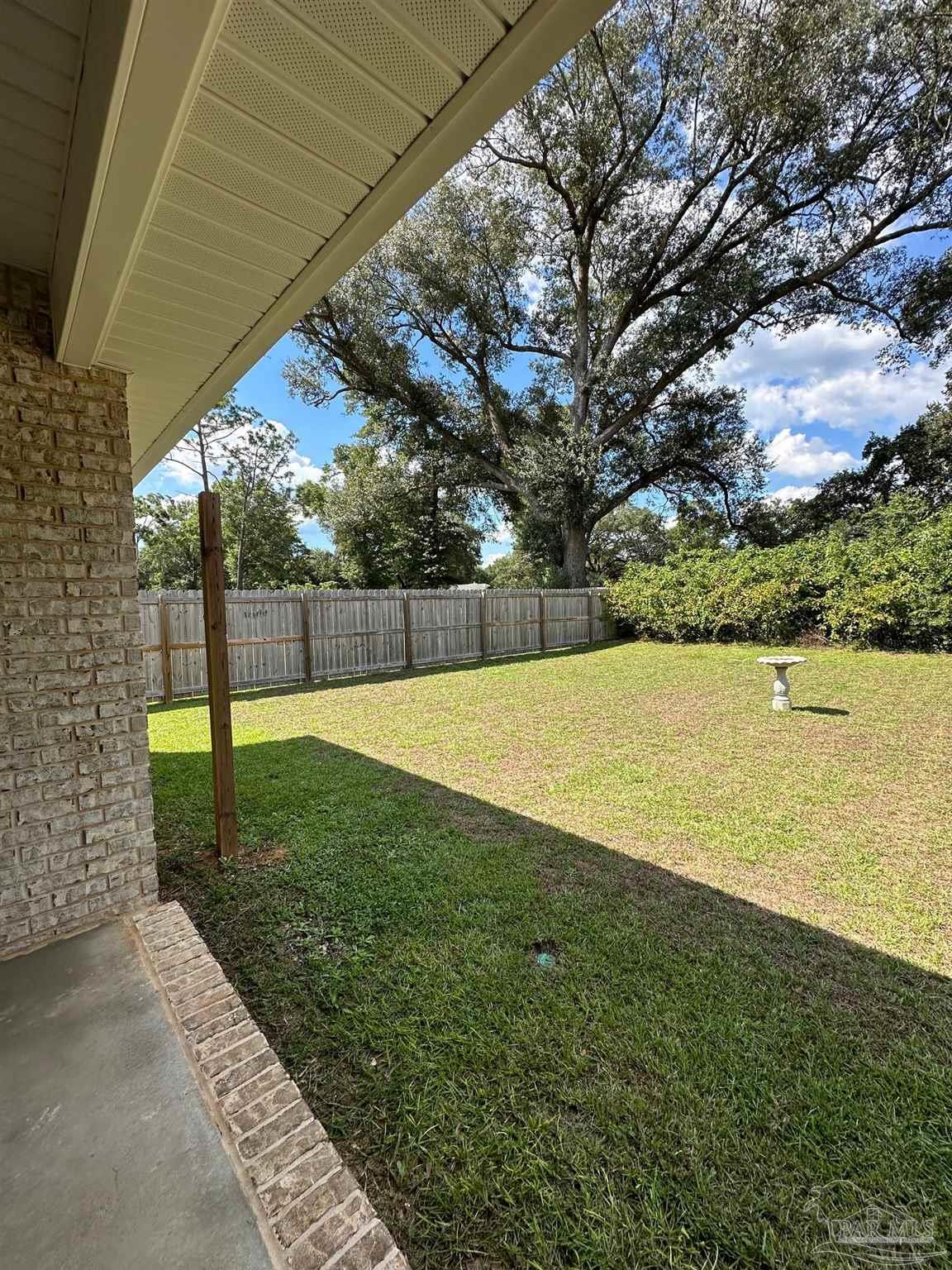 4466 Jude Way Pace, FL 32571 - Photo 26 of 27 Covered Porch in Backyard and Full Privacy Fencing