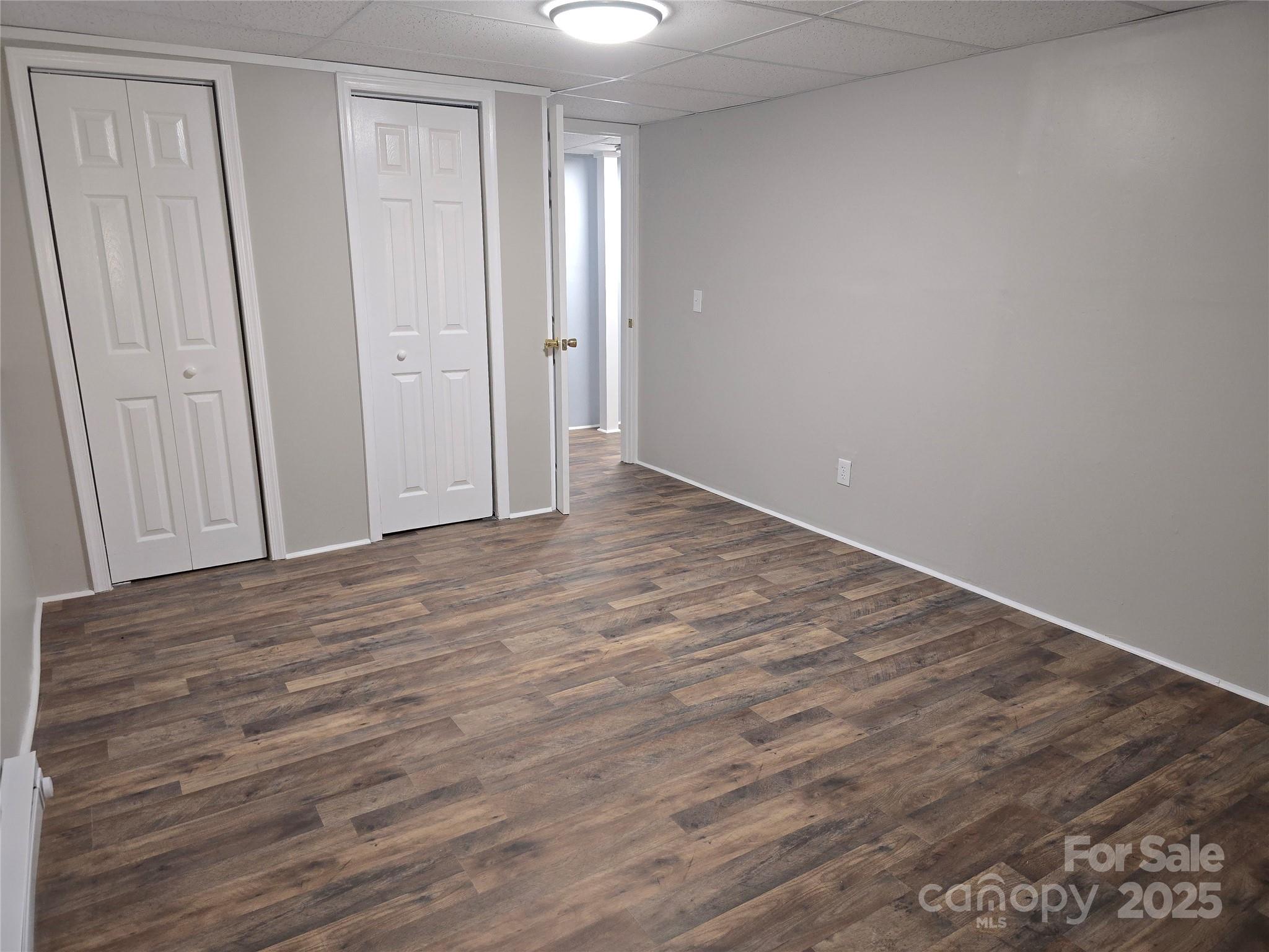 1660 Songwood Road Concord, NC 28025 - Photo 28 of 32 a view of an empty room with wooden floor