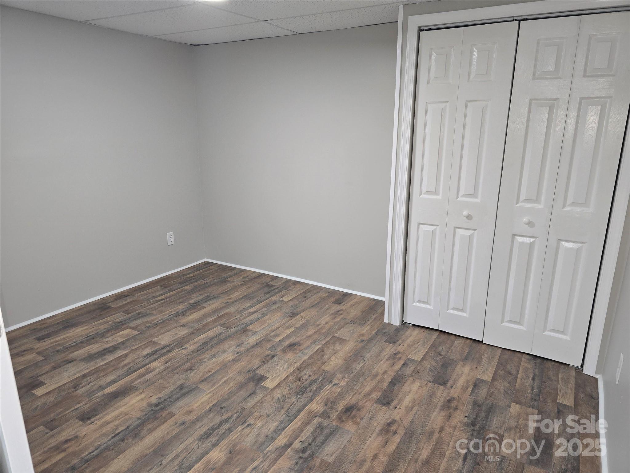 1660 Songwood Road Concord, NC 28025 - Photo 29 of 32 a view of empty room with wooden floor