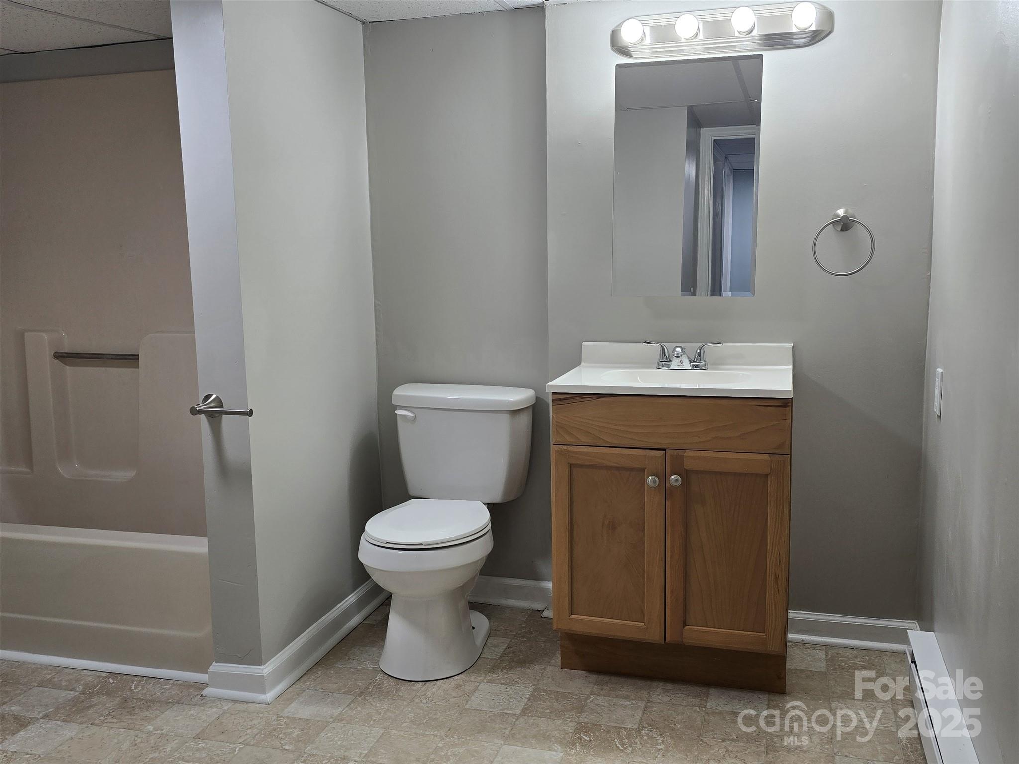 1660 Songwood Road Concord, NC 28025 - Photo 31 of 32 a bathroom with a sink toilet and shower
