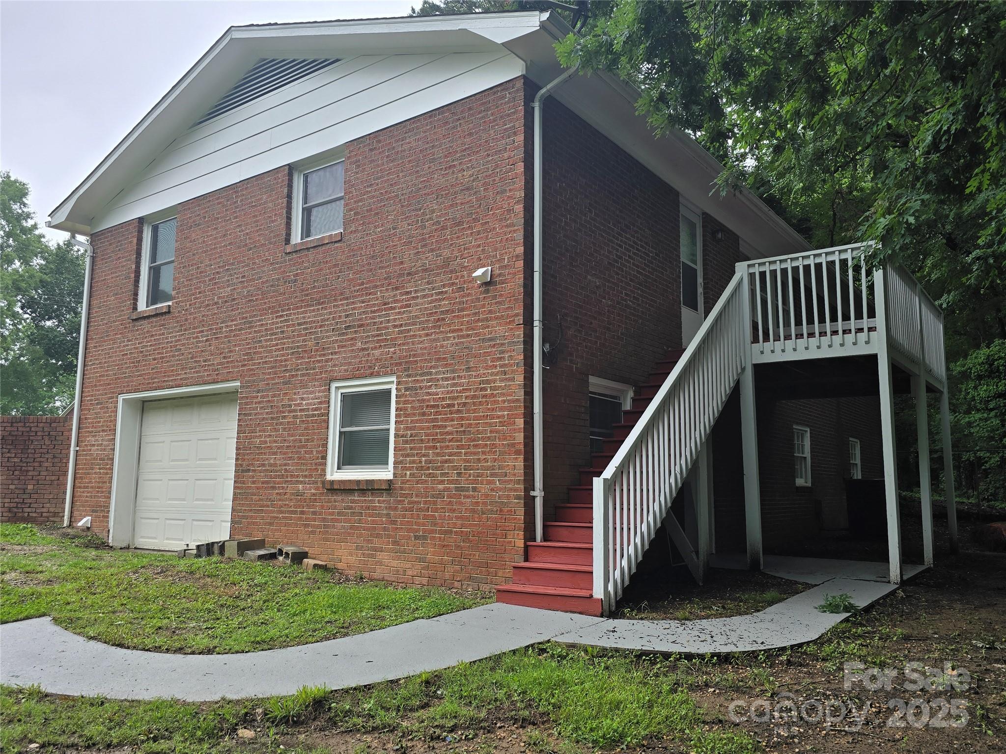 1660 Songwood Road Concord, NC 28025 - Photo 4 of 32 a front view of a house with a yard