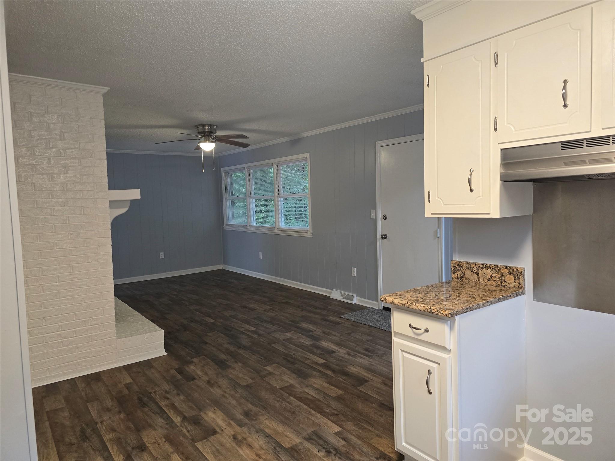1660 Songwood Road Concord, NC 28025 - Photo 10 of 32 a kitchen with a stove and a refrigerator