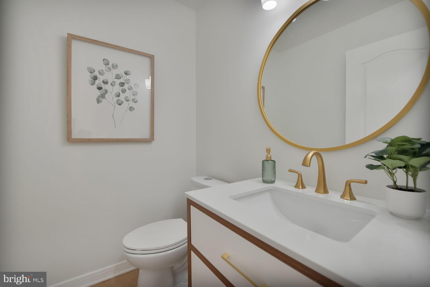 20881 Trinity Square Sterling, VA 20165 - Photo 11 of 35 a bathroom with a toilet and a sink