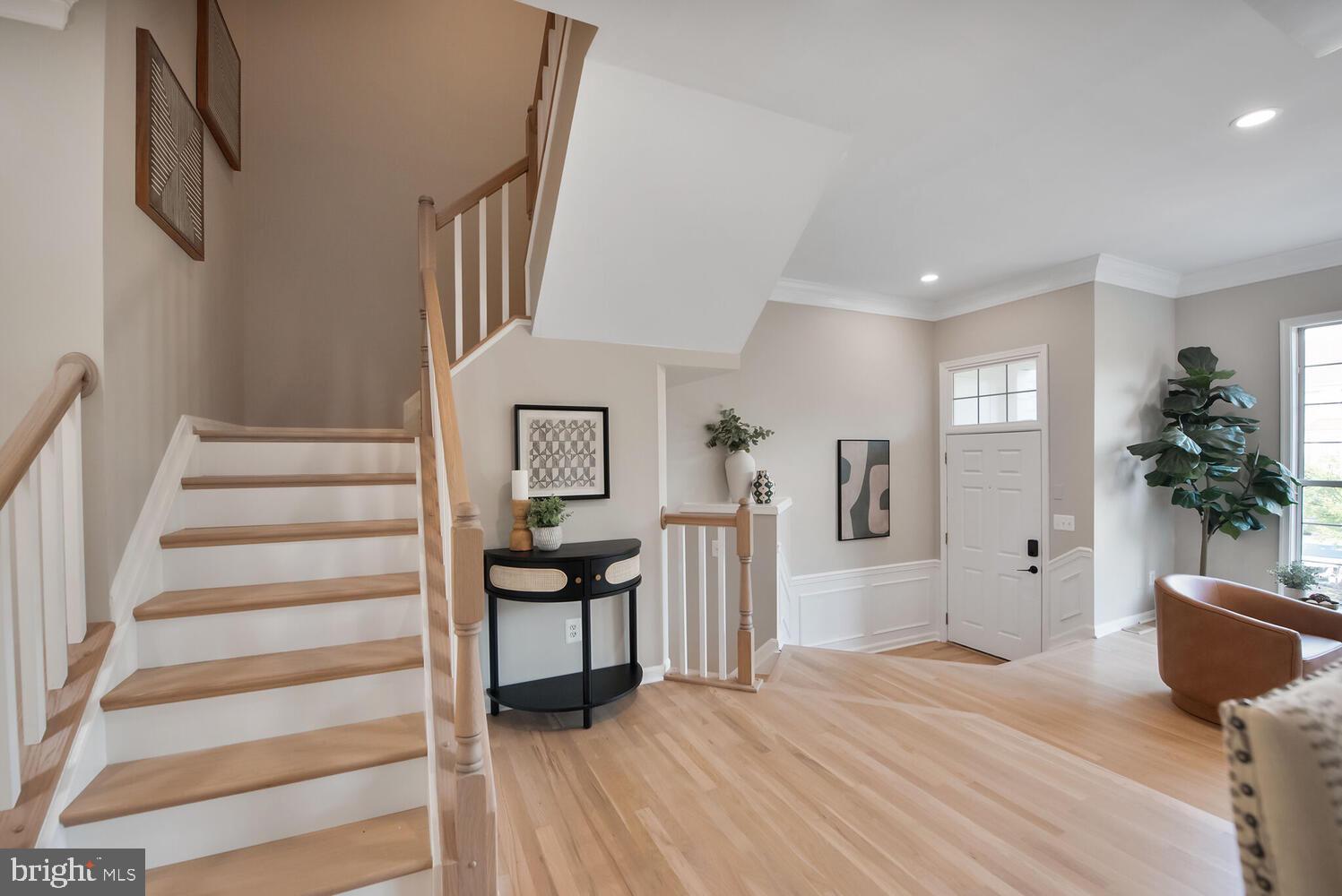 20881 Trinity Square Sterling, VA 20165 - Photo 12 of 35 a view of entryway and hall with wooden floor