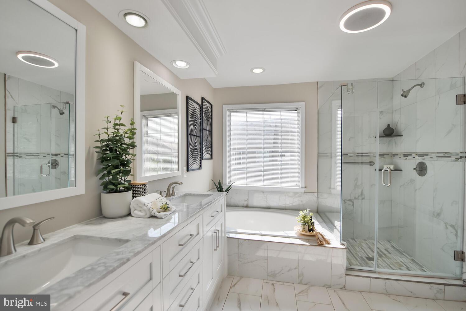 20881 Trinity Square Sterling, VA 20165 - Photo 16 of 35 a bathroom with a tub sink and mirror
