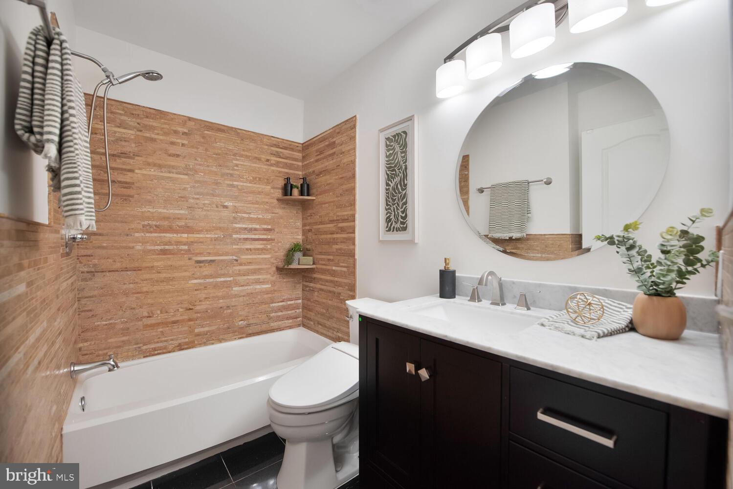 20881 Trinity Square Sterling, VA 20165 - Photo 18 of 35 a bathroom with a granite countertop toilet sink and mirror
