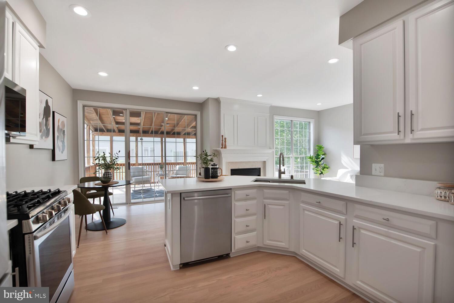 20881 Trinity Square Sterling, VA 20165 - Photo 6 of 35 a kitchen with a sink stove and cabinets
