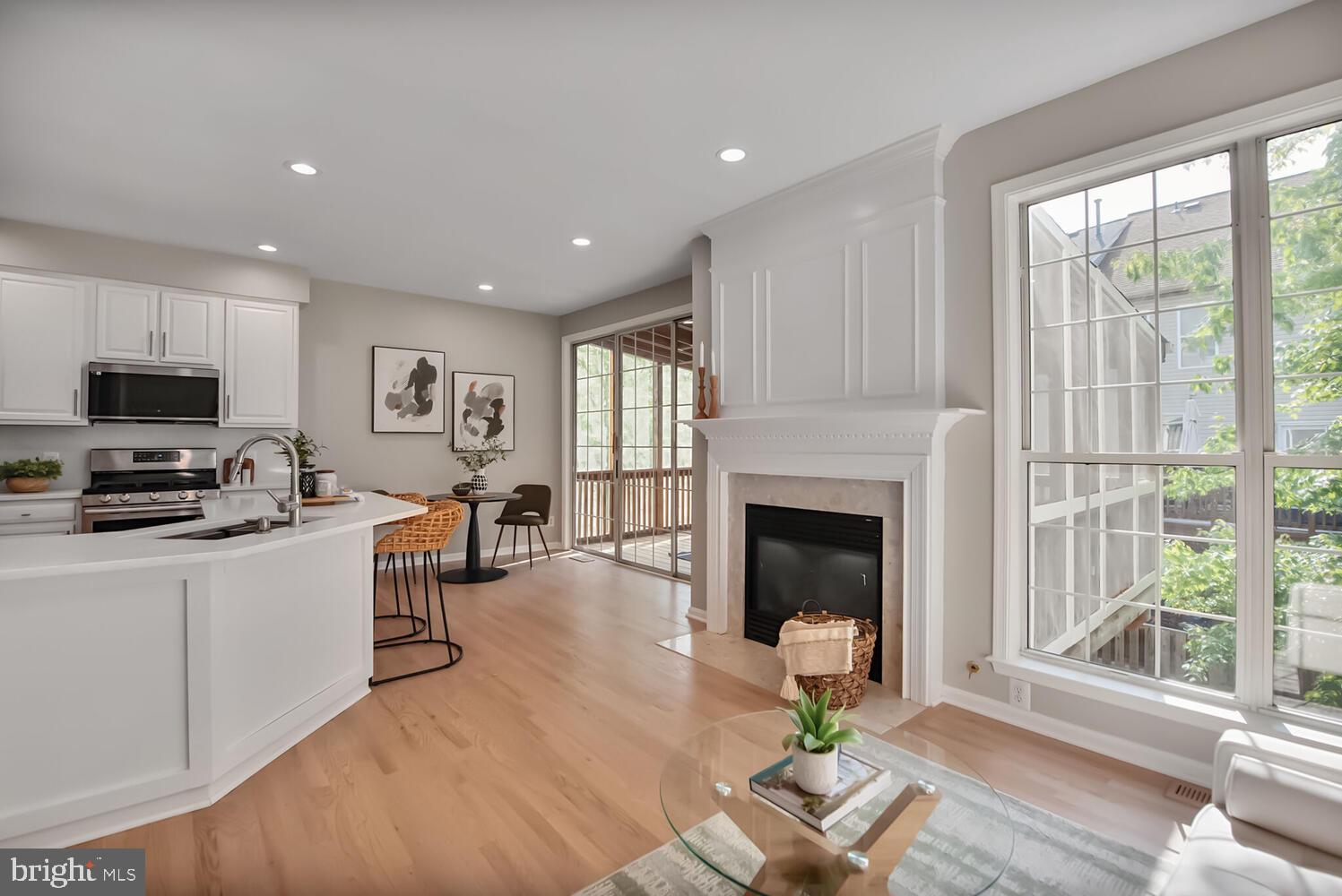 20881 Trinity Square Sterling, VA 20165 - Photo 7 of 35 a living room with furniture a fireplace and a flat screen tv