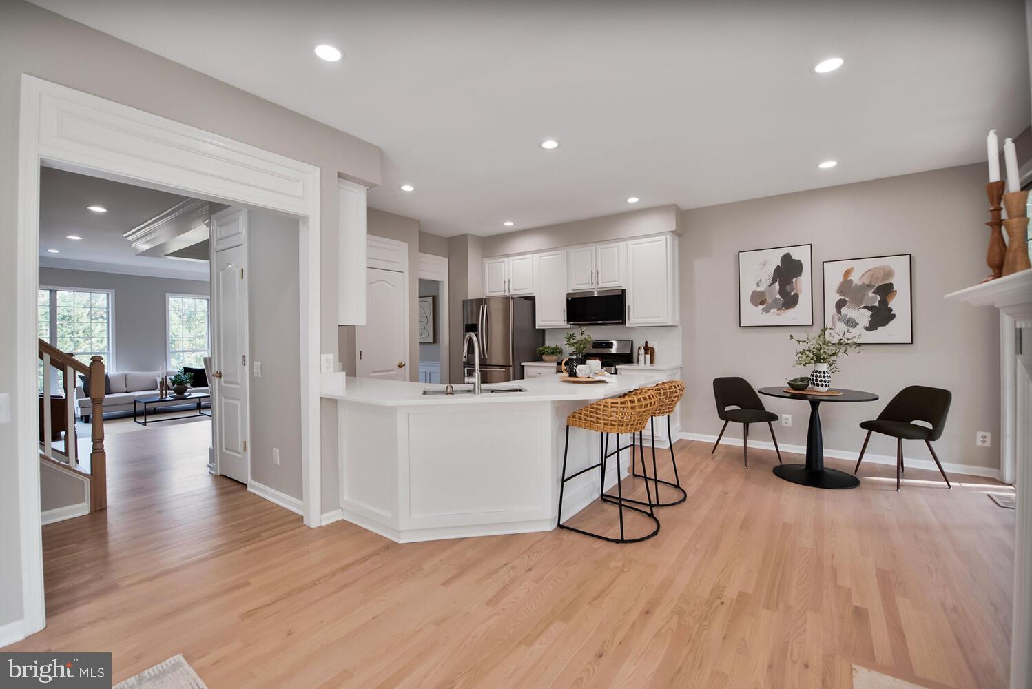 20881 Trinity Square Sterling, VA 20165 - Photo 8 of 35 a view of kitchen with cabinets and wooden floor