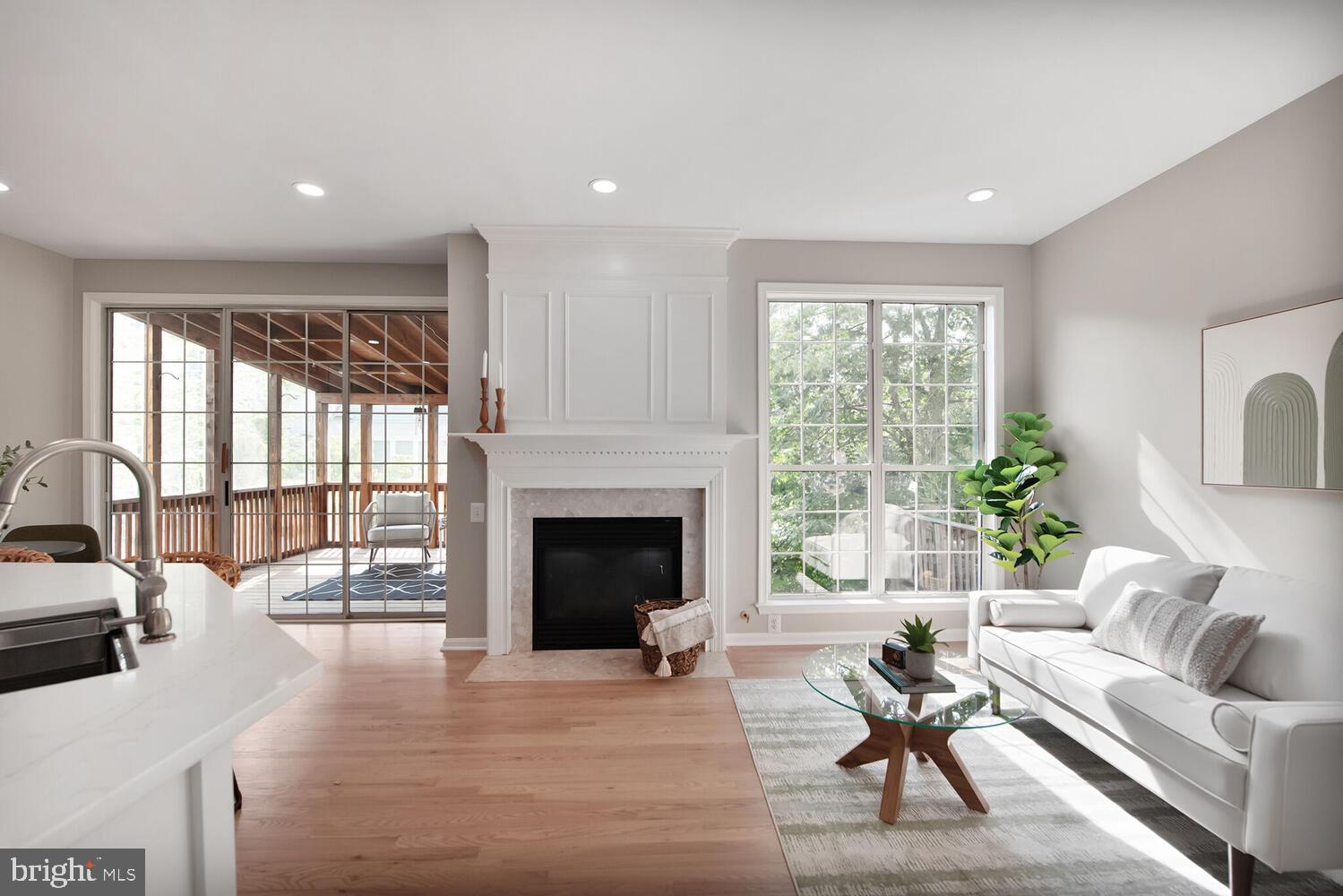 20881 Trinity Square Sterling, VA 20165 - Photo 9 of 35 a living room with furniture fireplace and a large window